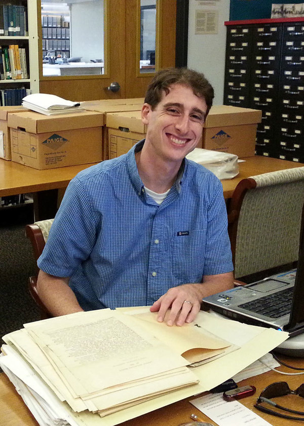William Cossen looks through the William James Onahan papers in the archives
